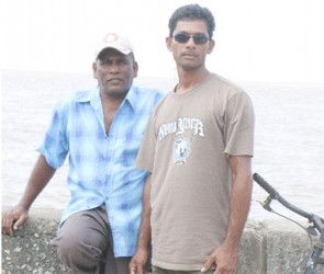 George and Gopaul Kumar hanging out at the Zeeburg seawall.