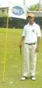 Almost a Hole In One! Young Avinash Persaud stands next to where his ball stopped on the Par three hole number 13