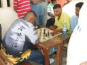 National champion Kriskal  Persaud (left) and his younger brother Shiv Persaud during their fiery encounter on Sunday at the JC Chandisingh secondary school in Berbice. The brothers have an intense rivalry at the chessboard, causing their fans to argue incessantly, and to place bets on their fancied player. 
