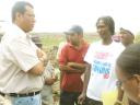 Agriculture Minister Robert Persaud (left) and Farmers’ Representative Committee Chairman Fitzroy Miller during discussions with farmers at Buxton backlands yesterday. Chief Executive Officer of the National Drainage and Irrigation Authority Lionel Wordsworth is at centre.