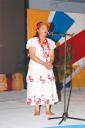 Minister within the Ministry of Education Dr Desrey Fox performing a traditional Amerindian song at the launch of Carifesta X last evening (Jules Gibson photo)