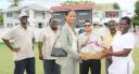 Player of the match Demerara’s Prudence Williams receives her Jergens hamper from Geddes Grant management trainee Suzette Shim as from left, Colin Europe, chairman of selectors Claude Raphael, new Demerara Cricket Board president Bissoondial Singh and vice president of the GCB Malcolm Peters look on admiringly. (Lawrence Fanfair photo)