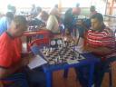 National chess champion Kriskal Persaud (right) from Rose Hall, Berbice, battles Dennis Dillon from Tuschen, East Bank Essequibo, for supremacy over the chessboard during last month’s Kei Shar’s  sponsored tournament. Both Kriskal and Dennis are participants in today’s blitz tournament in Port Mourant.