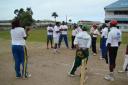 Dinanath Ramnarine, third left, is seen explaining the finer points of leg-spin bowling to the eager young participants.
