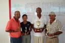 Winner Mel Sankies (centre) poses with other prize winners Ramesh Amrud (left), Christine Sukhram and Chatterpaul Deo.