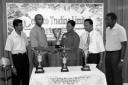 Ms. Nathely Mars (Human Resources Manager DeSinco Trading Limited) hands over the trophy to Shaun Messiah (Chairman of the Competitions Committee of the GCA) whilst from left Shalim Baksh (Secretary GCA), Bish Panday (President GCA) and Alfred Mentore (Vice President GCA) look on.