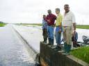 Examining the spill weir: From left to right are Regional Chairman Harrinarine Baldeo; Minister of Agriculture Robert Persaud; Aditya Persaud of the Ministry of Agriculture and Chairman of MMA/ADA, Rudolph Gajraj.
