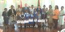 Canadian High Commissioner Charles Court (fourth from left) Minister of Education Shaik Baksh (fifth from left) and Minister within the Ministry of Education Desiree Fox (sixth from left) stand with head teachers and students from various primary schools as they display their awards.