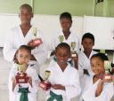 The six first -placed finishers in the Guyana Wado Ryu Karate Championships display their trophies which were sponsored by Banks DIH Limited.