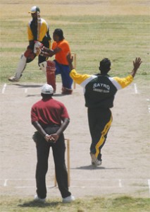 Andre Percival is caught by photographer Lawrence Fanfair after playing this pull shot during his innings of 57 in the third place match between Rose Hall Town Windies Sports Bar and Leguan at the Albion Sports Complex on Sunday.