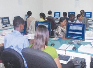 Encoders at work in the data entry section of the Guyana Elections Commission.