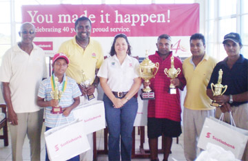 Imran Khan (third from right) and Scotiabank Country Manager Amanda St. Aubyn (centre) pose with other prize winners and representatives of the bank and Lusignan Golf Club.