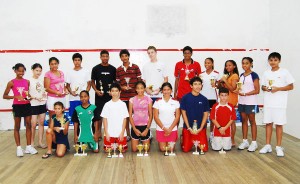 The winners of the various categories of the Woodpecker Products Ltd., sponsored national junior squash championships pose for photographer Lawrence Fanfair.
