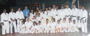 Minister of Sport Dr Frank Anthony, (fourth from left, back row) poses with the graduates and other members of the Karate Association. (Aubrey Crawford Photo)