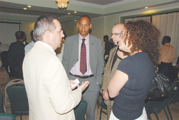 Mark Mostovac (left) of the Canadian High Commission makes a point to resource persons including Assistant Director of the Commonwealth Parliamentary Association (CPA) Shem Baldeosingh (centre) and Juliet Solomon (right) of the Commonwealth Secretariat at the CPA-sponsored parliament and media seminar yesterday at the Grand Coastal Inn. (Photo by Jules Gibson)    