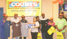 Roberta Smith (fourth from left) and other players celebrate their winnings in the Courts ‘Go Digital’ promotions. Courts has announced the winner in its first game of Musical Chairs which was held as a part of its ‘Go Digital’ promotion. Roberta Smith danced her way to the final chair in the game and walked away with a $50,000 Oster Pressure Cooker. In celebrating her victory Smith told Stabroek News, “I haven’t played this game since I was at Primary School. It was fun.” The company said eight lucky customers were given the chance to win the cooker. The other participants were Cecelia Henry, Karno Dass, Dolly Sham, Sooklall Shiwnarain, Patrick Farley-Grant, John Sukhdeo and Madodrie Budhoo. They were each given consolation prizes. Customers, who spend more than $5,000 between May 12 and June 30 will not have to make down payments and will get three free instalments and a chance to win over $500,000 in prizes.