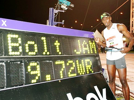 LIGHTNING BOLT! The Jamaican shows off the time after he bolted to a world record of 9.72s on Saturday.