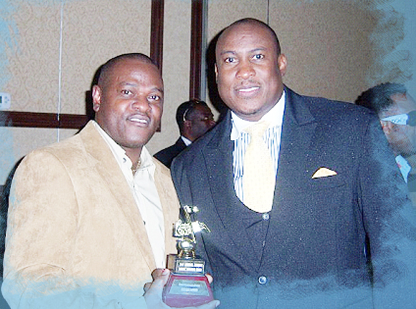 Ernie Trelfall (left) poses with top Jamaican MC Richie B of Hot 105