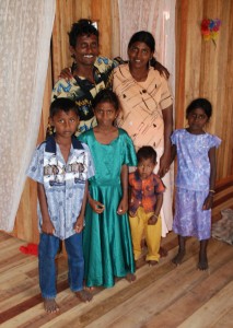 The Basdeo family in their new home yesterday. (Jules Gibson photo)  