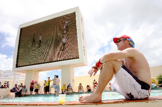An Australian fan sits by the pool and waits for the cricket to begin (cricinfo photo)