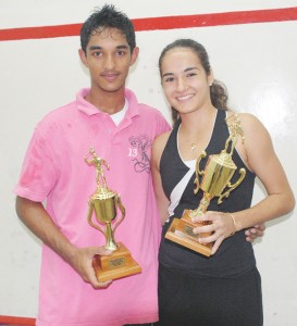 NEW KING;SAME OLD QUEEN! Kristian Jeffrey, left, won his first national men’s singles title but for Nicolette Fernandes, right, back after injury, it was her third time on the throne of women’s squash. (Clairmonte Marcus photo)