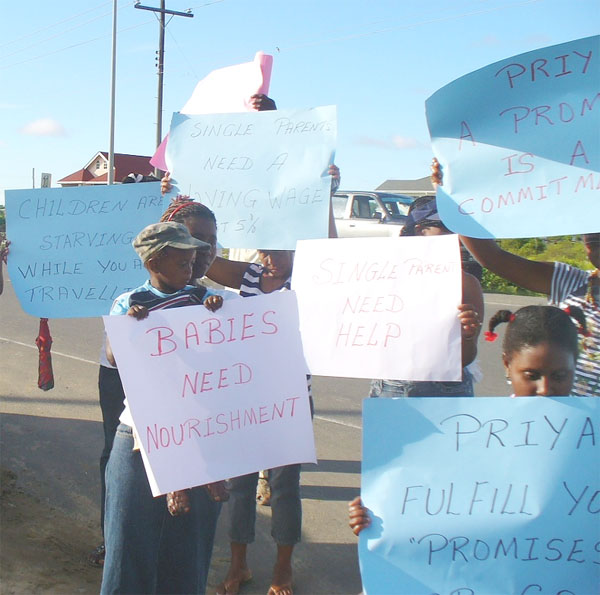 Some of the children displaying placards during the launching of the legal aid clinic at Fort Wellington