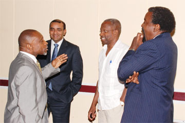 Deputy Senior Director of the Caribbean Regional Negotiating Machinery (CRNM) or former finance Minister Carl Greenidge (left) makes a point to President Bharrat Jagdeo, Minister of Foreign Trade and International Cooperation Dr Henry Jeffrey and CRNM technical Analyst Nigel Durrant during a break yesterday.  (Photo by Jules Gibson)     