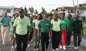 Caricom Assistant Secretary-General Dr Edward Greene (centre) leading a team of walkers