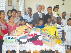 Mark Benschop and Peter Ramsaroop with some of those that donations were made to.