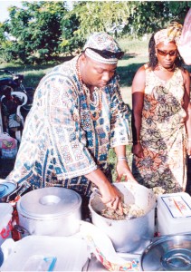 Dishing cook-up rice at the National Park on Emancipation Day 2006. (Stabroek News file photo) 