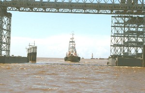 A tug belonging to the bridge project preparing to go under the high span