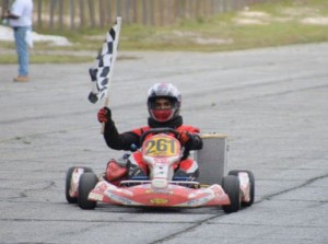 Kristian Jeffery takes the checkered flag after one of the 125cc Shifter Go-kart early this year at South Dakota Circuit.   