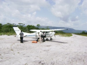 On the ground: The tiny Air Services Limited Islander shortly after touchdown at the Arau airstrip (at right). 