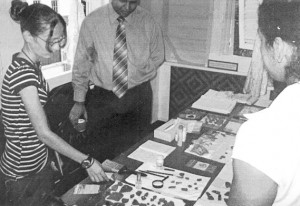 Diana Fernandes (left) describing archaeological exhibits on display to her audience, including Culture Minister Dr Frank Anthony. 