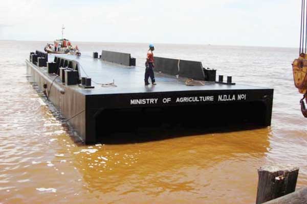 The pontoon manufactured by Courtney Benn Contracting Service for the desilting of outfall channels along the coast.  (GINA photo)