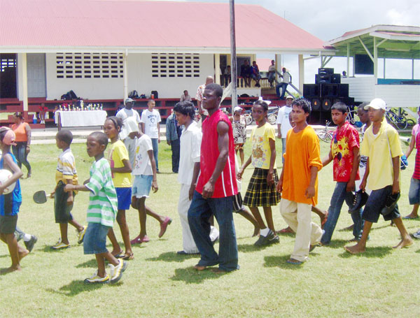Members from Berbice youth clubs traverse the field where the Police Force ‘B’ Division hosted its fun day. 