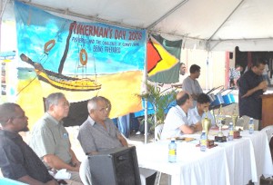 Acting Chief Co-op Development Officer Kareem Abdul Jabar, NAAG Chairman Dr Leslie Chin, Georgetown Fisherman’s Co-op Society Chairman Mohamed Khan, Private Trawler Association President Bruce Vieira and National Climate Committee Chairman Shyam Nokta pay keen attention as Minister of Agriculture Robert Persaud addresses the gathering.