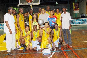 New Champs!! The Champions of the 2008 Pepsi National Schools’ Basketball Festival Linden Technical Institute and their coaching staff are joined by Minister of Culture, Youth and Sport Dr Frank Anthony and representative of Demerara Distiller Ltd Alana Johnson after receiving their medals and championship trophy.        