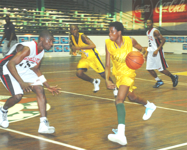  LTI point guard Donnel Benjamin on one of the occasion that he blew past GTI’s Kevin Jordan with a stutter-step step during LTI’s 47-45 win at the Cliff Anderson Sports in the NSC Pepsi National Schools’ Basketball Festival yesterday.  (Clairmonte Marcus photo)