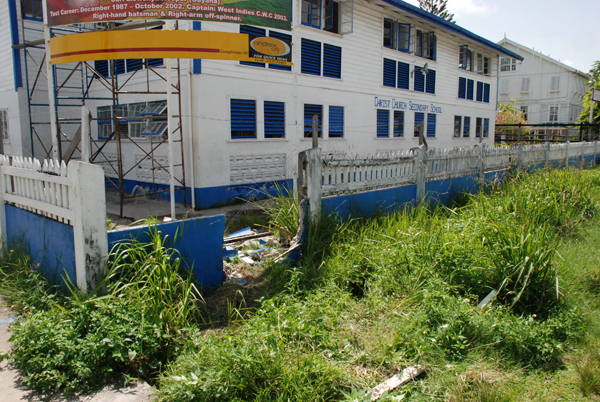 The damaged fence of the Christ Church Secondary School at Middle and Camp Streets.