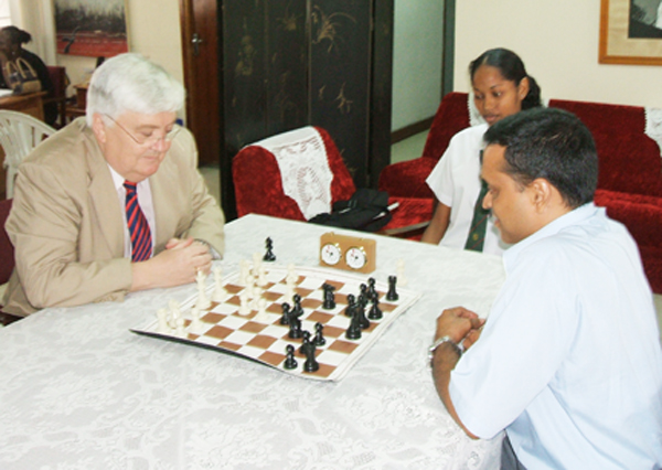 Iceland’s first Ambassador to Guyana, His Excellency Hjalmar Hannesson, plays a game of chess with Shiv Nandalall, Treasurer of the Guyana Chess Federation. Watching the game is chess enthusiast Annelisa Persaud of the Richard Ishmael Secondary School. Iceland hosted the famous Fischer-Spassky chess match of 1972, and is one of the world’s foremost chess-playing nations. Ambassador Hannesson presented his credentials to President Bharrat Jagdeo on Monday accrediting him as his country’s Ambassador to Guyana.