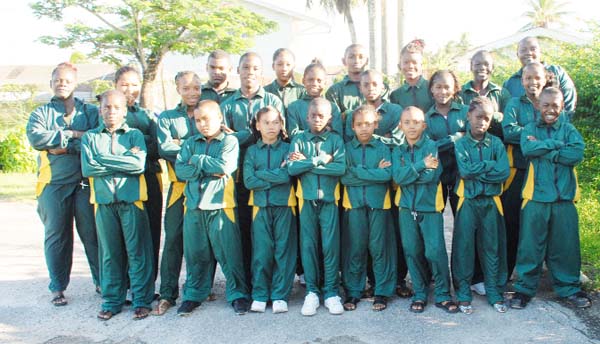 All for nothing!!! The 20 CUT Games hopefuls decked out in the track suits that they would have worn at the 2008 CUT Games yesterday outside GUT Woolford Avenue, before realising that the trip was cancelled because of financial issues and airline bookings.  (Clairmonte Marcus photo)