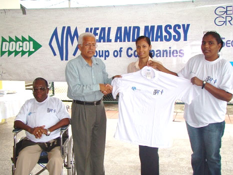  Displaying the jerseys handed over to the SGDP on Friday. Second from left is Chief Executive Officer of Neal and Massy, Deo Persaud.
