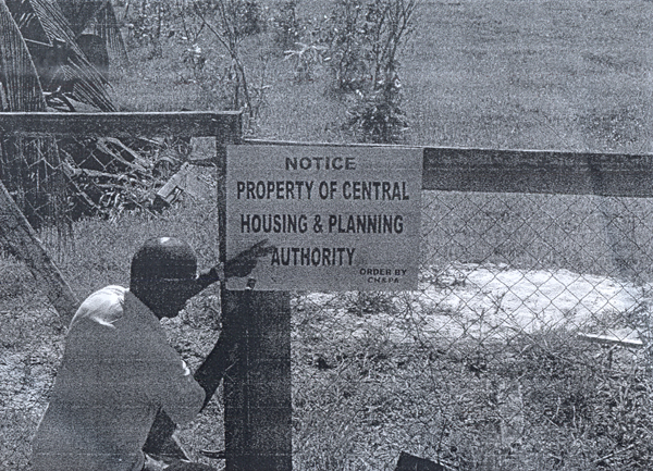On June 20, a Ministry of Housing employee posted this sign on the disputed plot of land at Crown Dam which the couple allegedly destroyed. 