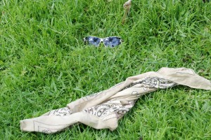 The sun shades and handkerchief believed to belong to one of the robbery suspects at the scene. (Jules Gibson photo)