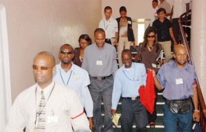 Members of the media leaving Parliament Buildings following a walkout from the Parliamentary chambers yesterday in protest at the banning of journalist Gordon Moseley from State House and the Office of the President. 
