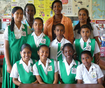 The successful students pose with their teachers (from left to right), Constance McCalmon, Stacy Williamson and Padmini Bissoon. The students (seated from left to right) are Chandanie Panday, Yasmin Shariff, Kennia Maynard and Adrian Budhu. Those standing from left are Cecelee Naraine, Debra Tulsi, Sukraj Beephat and Andrea Persaud.    