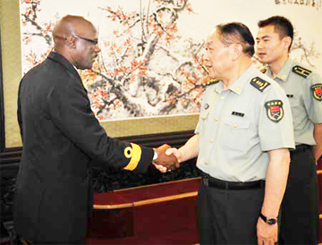 Chinese Defence Minister Liang Guanglie (2nd R) meets with Commodore Gary Best (L), Chief of Staff of the Guyana Defence Force, in Beijing yesterday. (Xinhua Photo)
