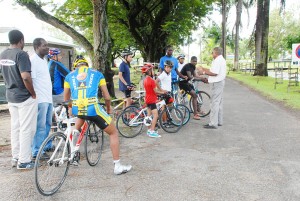 National cycling coach and programme instructor Hassan Mohammed goes through the paces with a few of the attendees during the programme at the National Park.(Clairmonte Marcus photo)