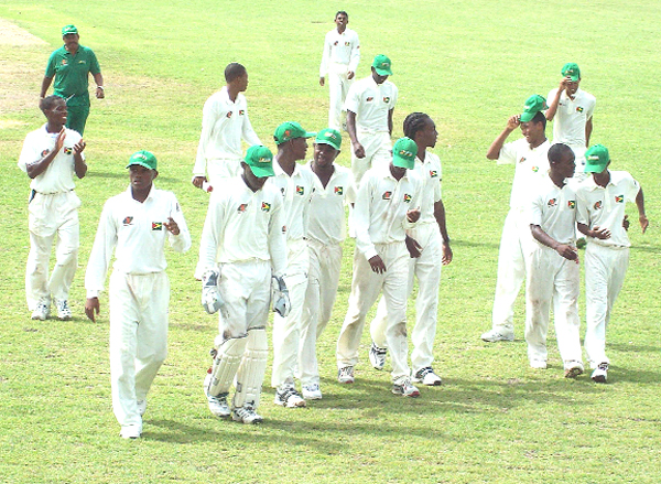 The victorious Guyana players celebrate their come-from-behind-triumph over the Windward Islands at the Combermere Secondary School ground, Bush Hall Barbados yesterday.